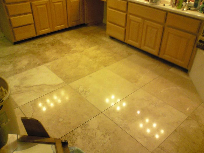 Kitchen with polished travertine tiles