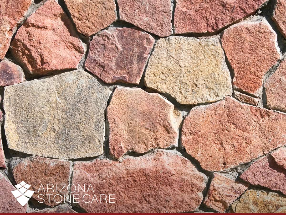 Close-up of flagstone with weather damage, showcasing natural wear and texture, by Arizona Stone Care